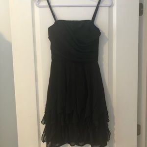 Black ruffled dress - le chateau